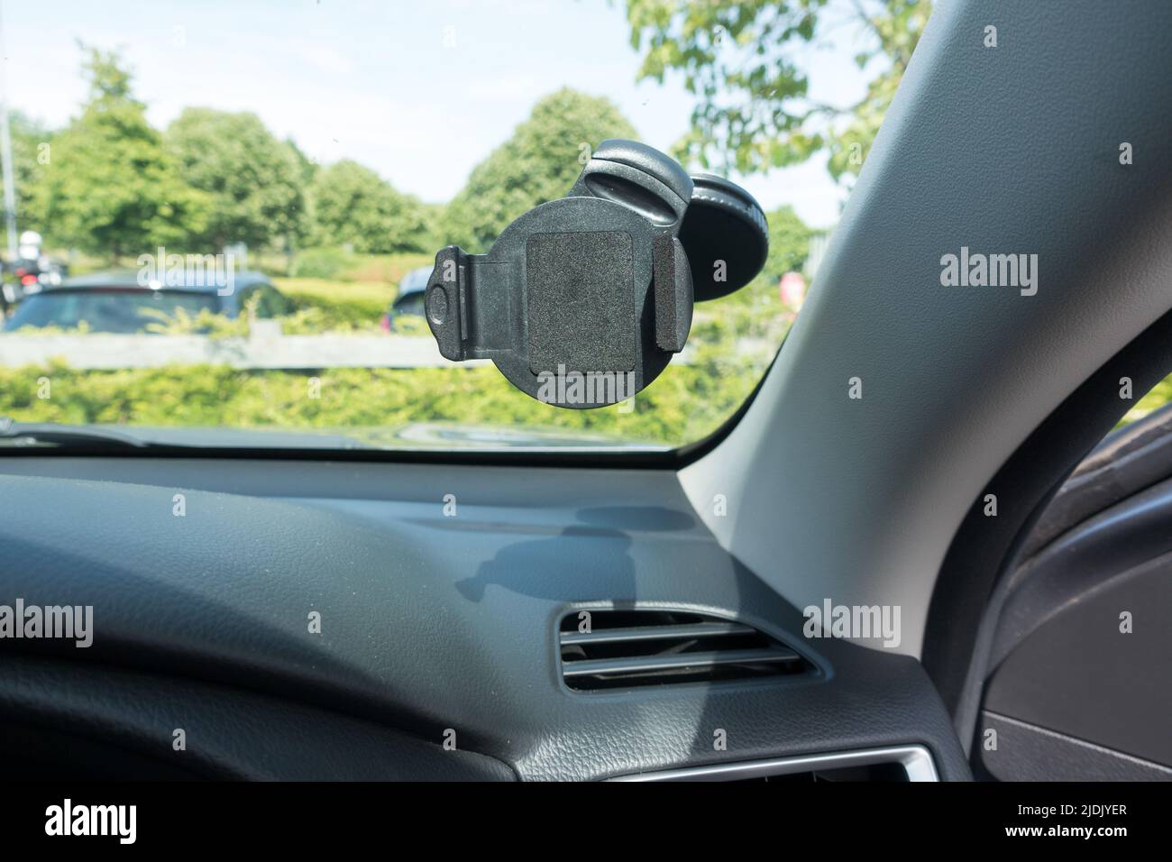 Mobile phone holder for navigational purpose in front of a car driver seat closer to the A post Stock Photo