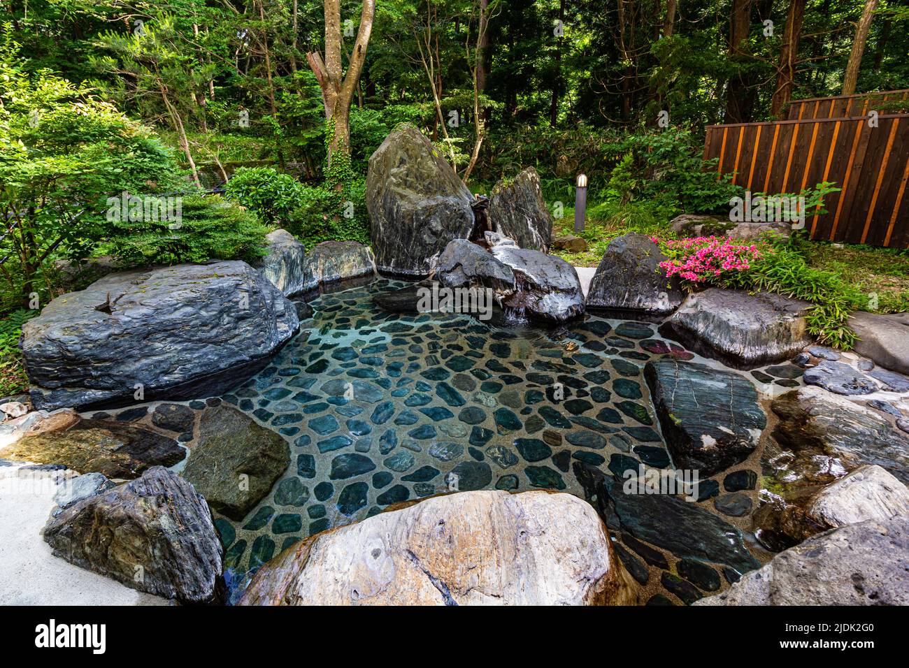 Rotemburo is an open-air hot spring called a 'rotemburo' in Japan. Bathing in a natural atmosphere, among the trees and under open skies is a favorite Stock Photo
