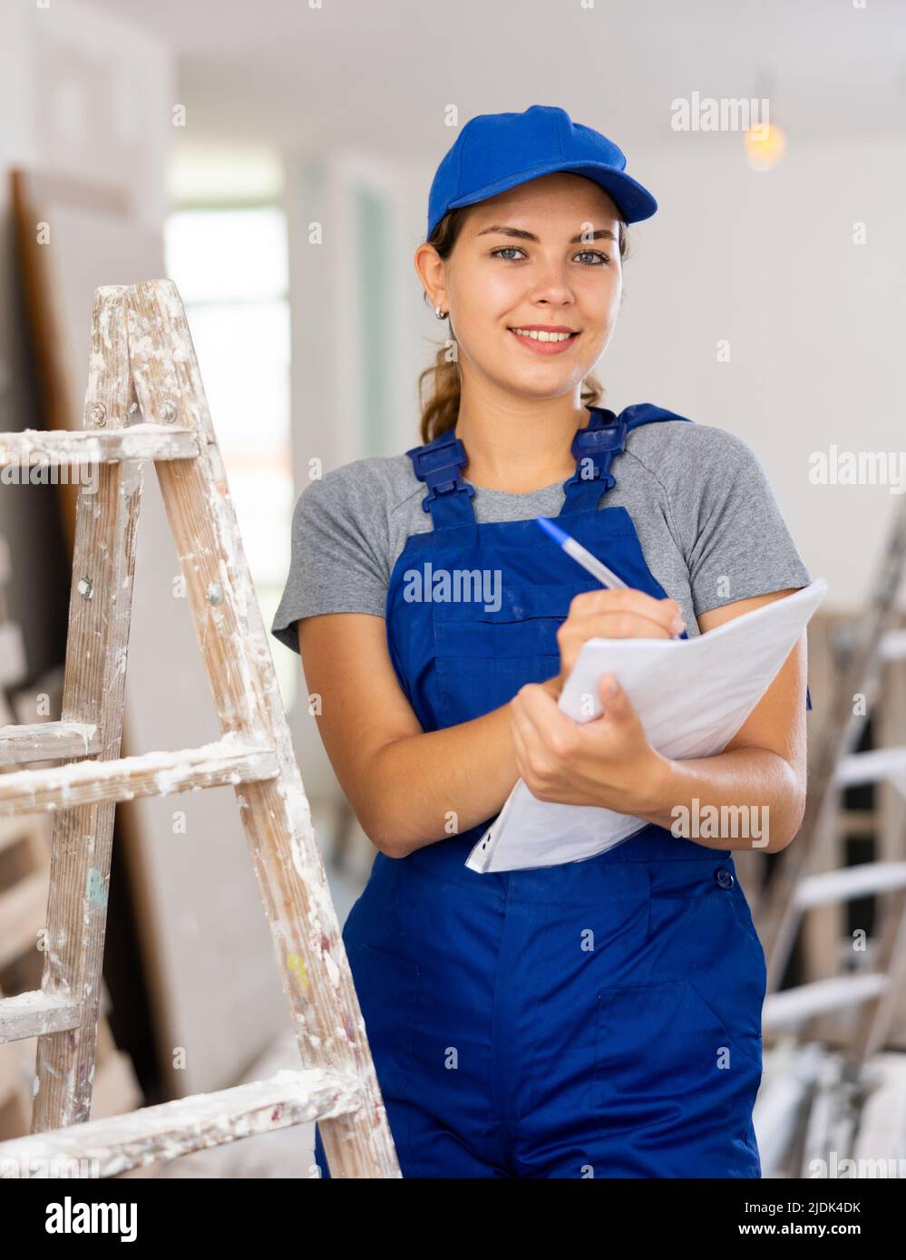 Woman construction worker with project documentation Stock Photo Alamy