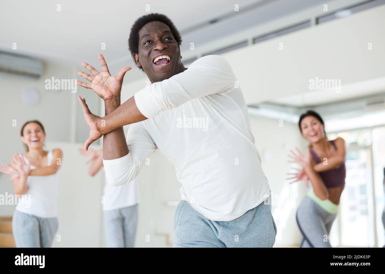 Group of multinational people practicing dance techniques Stock Photo