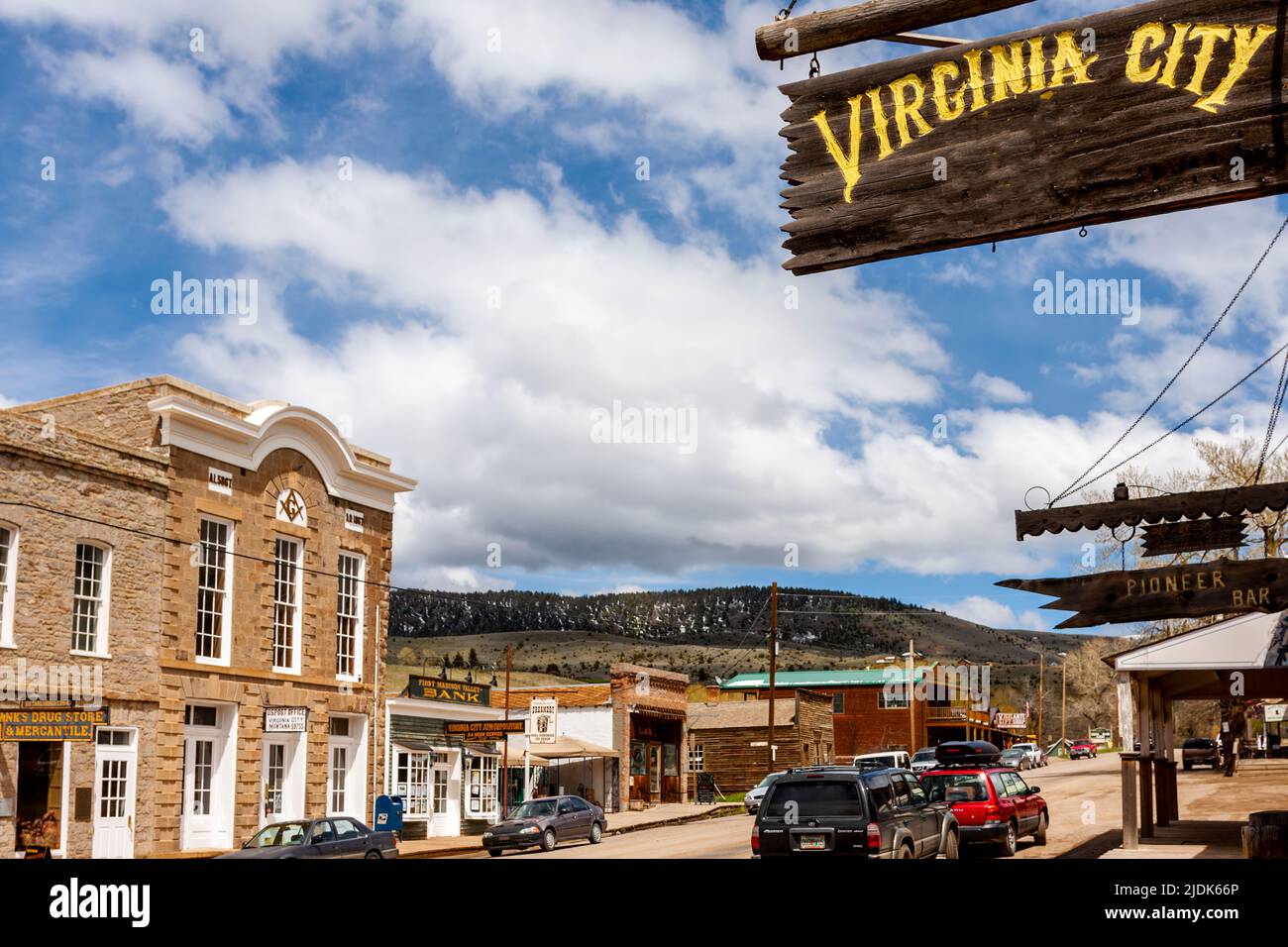 Ghost town at Virginia City is now a tourist attraction in Montana. Deserted log cabins, train wreck yard and gift shops in town. Stock Photo