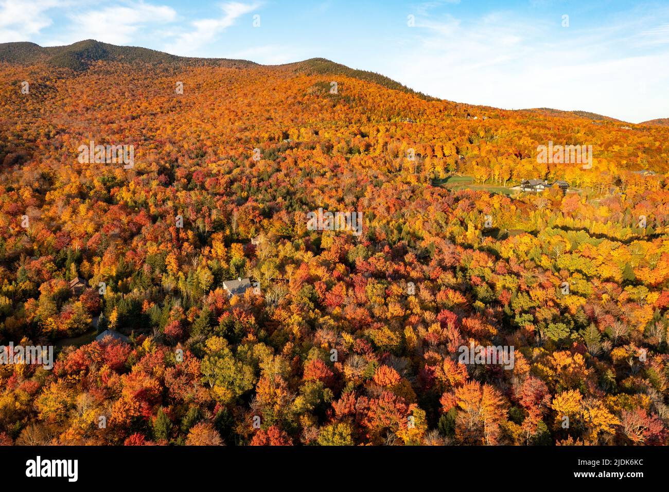 Panoramic view of peak fall foliage in Smugglers Notch, Vermont Stock