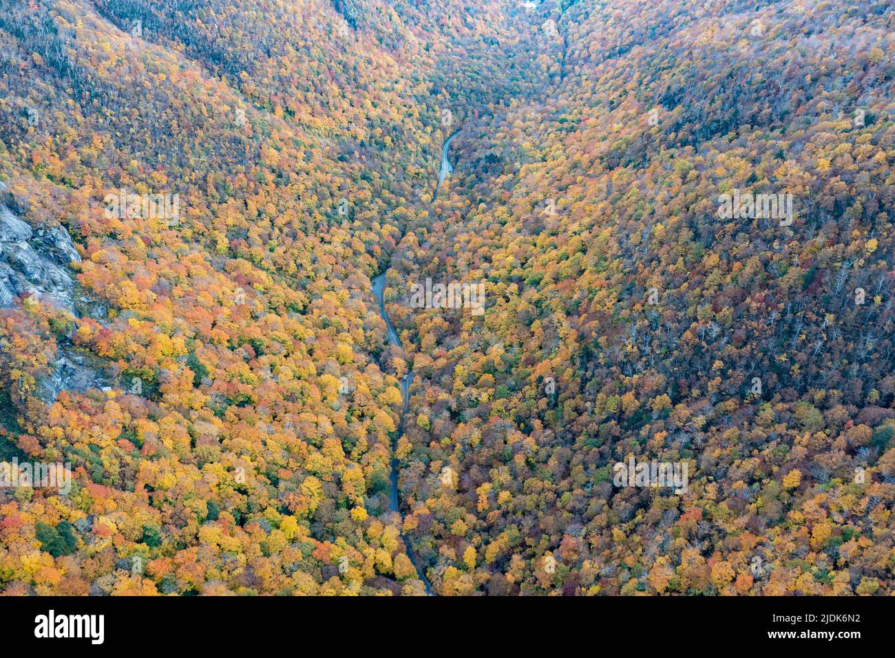 Panoramic view of peak fall foliage in Smugglers Notch, Vermont. Stock Photo