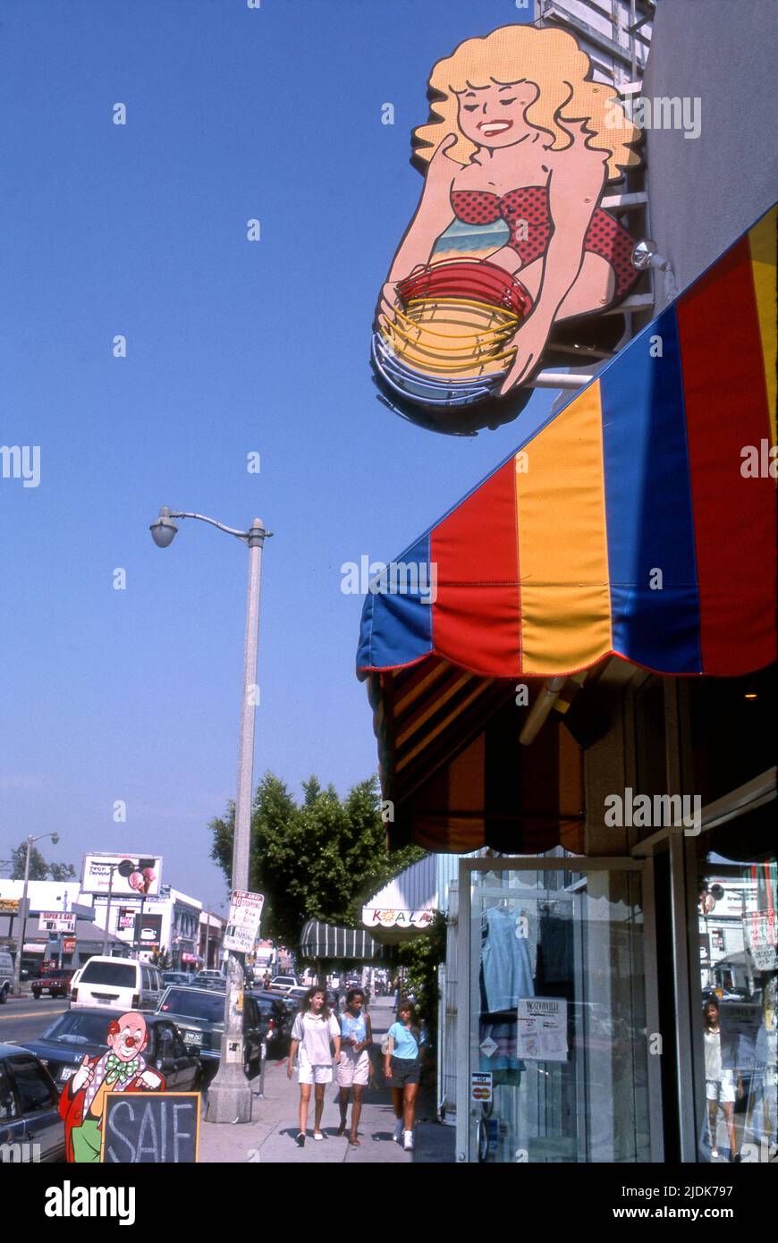 Young girls walking on Melrose Ave. in Los Angeles, circa 1980s Stock Photo