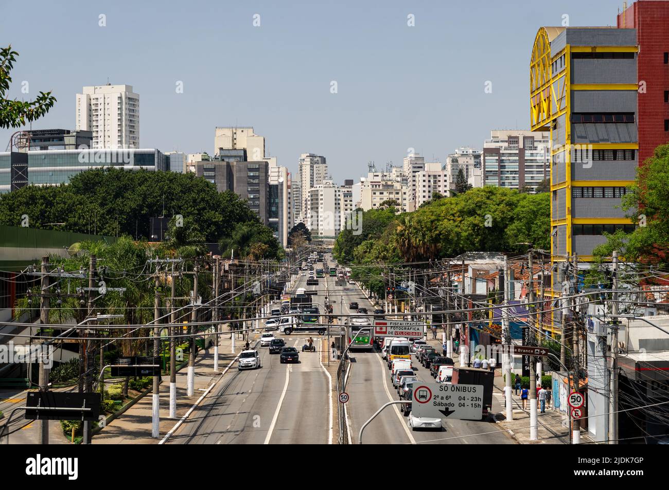 Heavy traffic passing by both ways of Francisco Matarazzo avenue in a normal business day with lots of skyscrapers at the back under sunny blue sky. Stock Photo