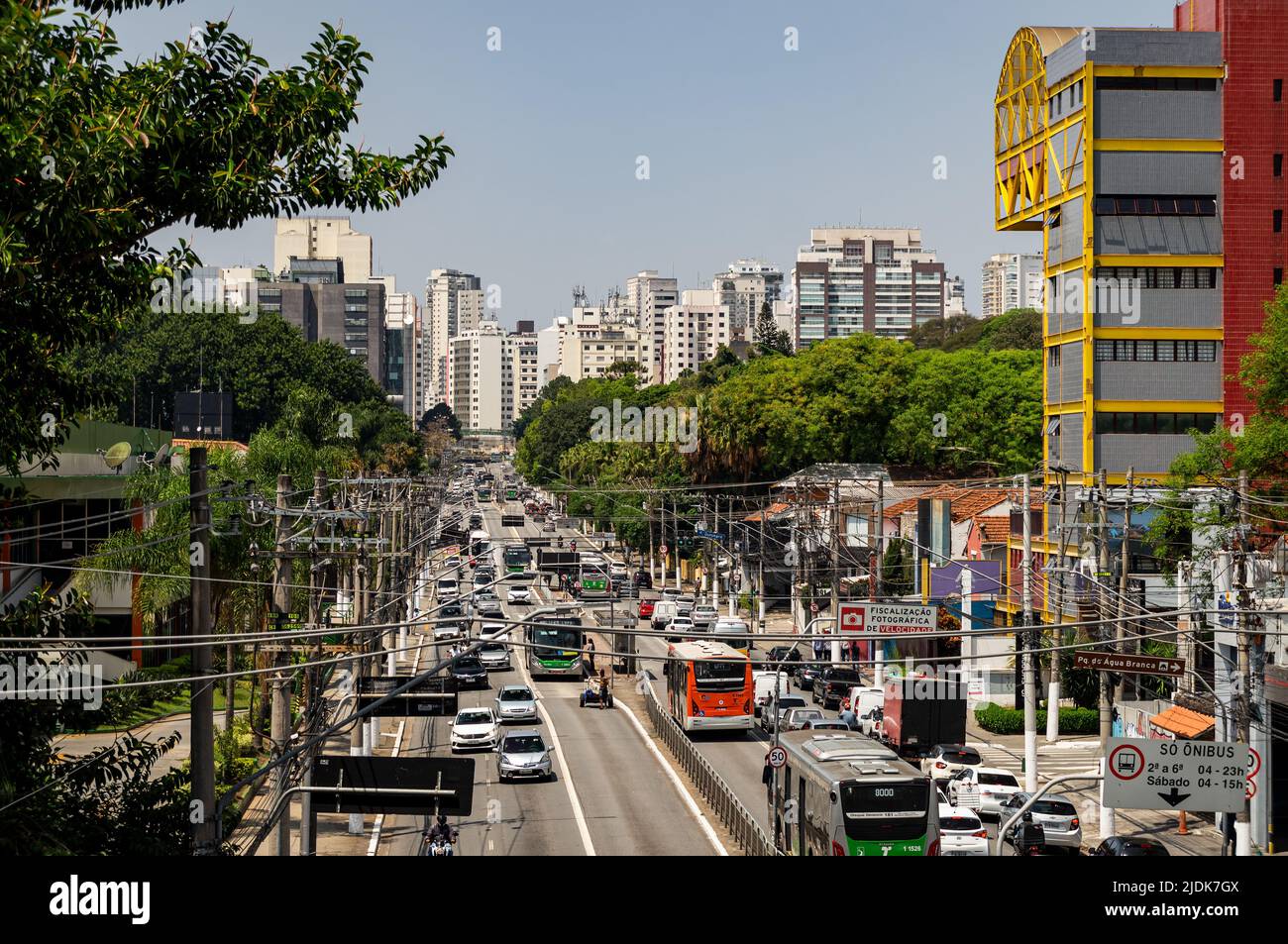 Heavy traffic passing by Francisco Matarazzo avenue in Agua Branca district in a normal business day with lots of skyscrapers at the back. Stock Photo