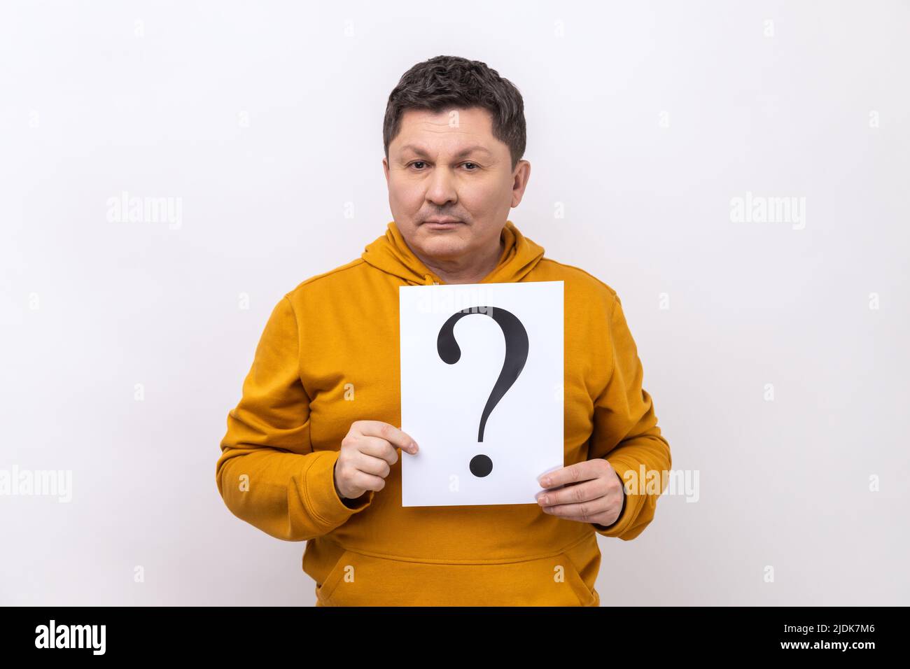 Good looking middle aged man holding question mark, finding smart solution, asking for advice