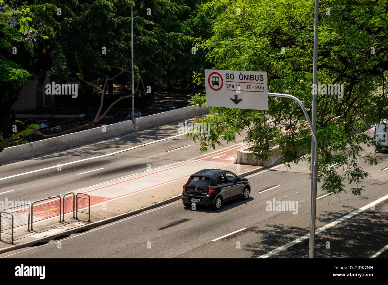 An educational road sign pointing to the bus lane location and time when they are operational in Antartica avenue, right at the Antartica viaduct. Stock Photo