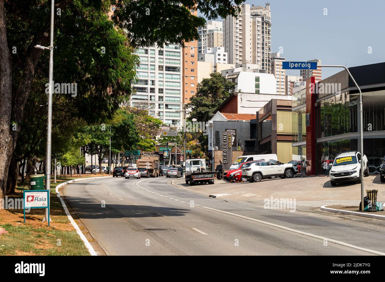 A curved section of Sumare avenue in Perdizes district area with lots of local business around and under sunny clear blue sky in a normal business day Stock Photo
