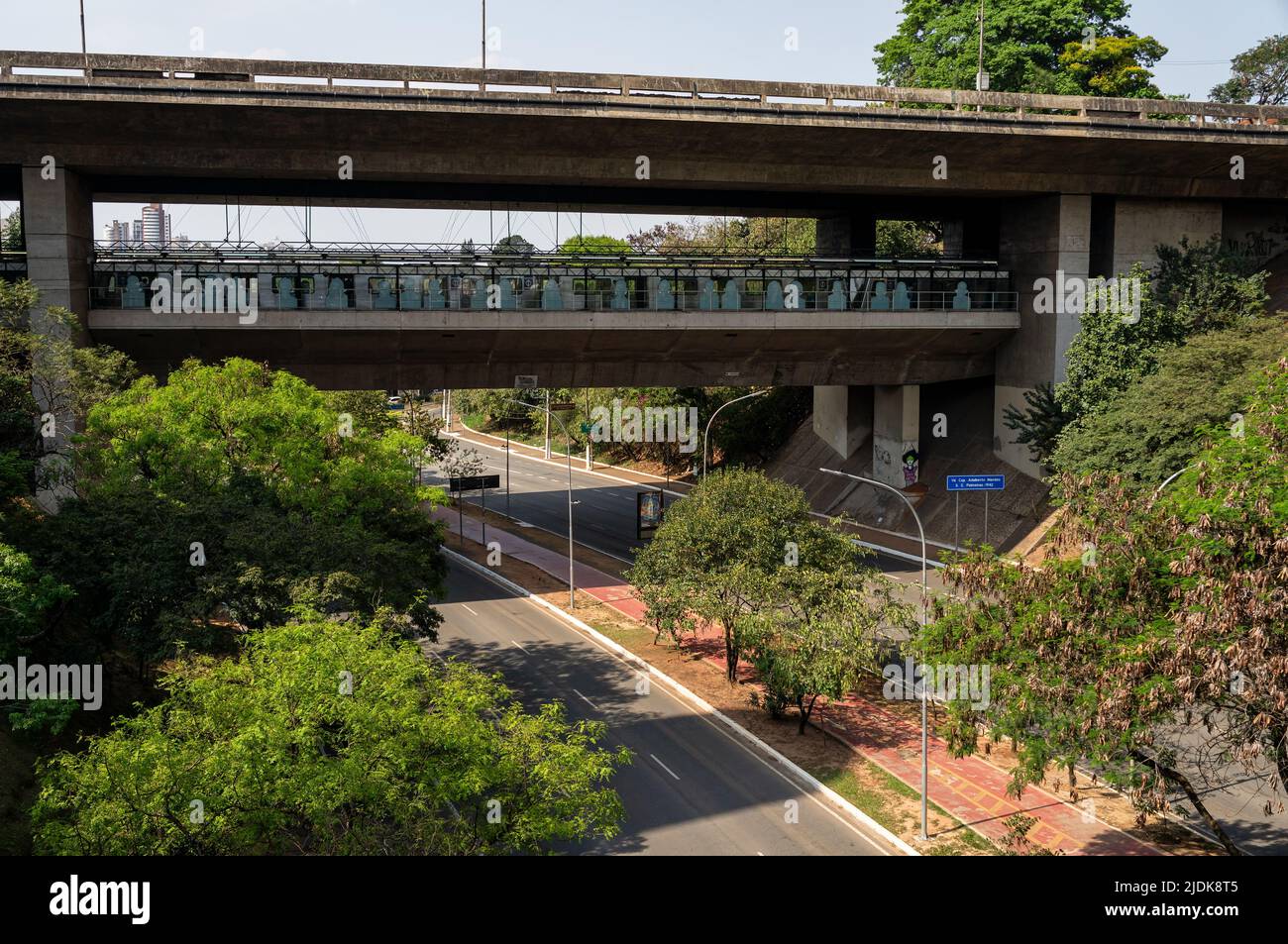 Opposite view of Sumare metro station (Line 2 - green) right below under Capitao Adalberto Mendes viaduct under sunny clear blue sky in a normal day. Stock Photo