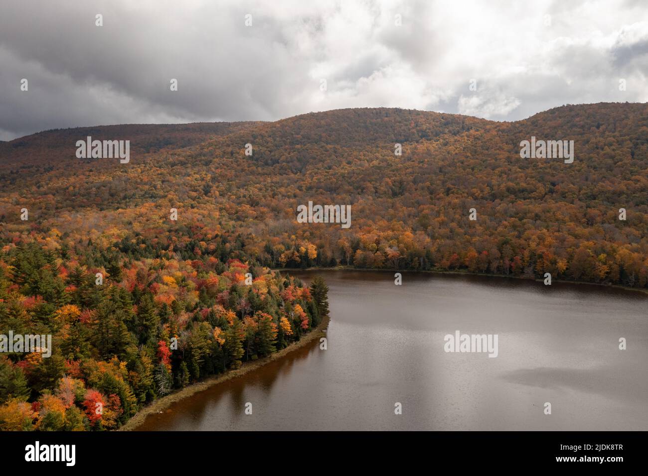 Colgate Lake in Upstate New York during peak fall foliage season Stock