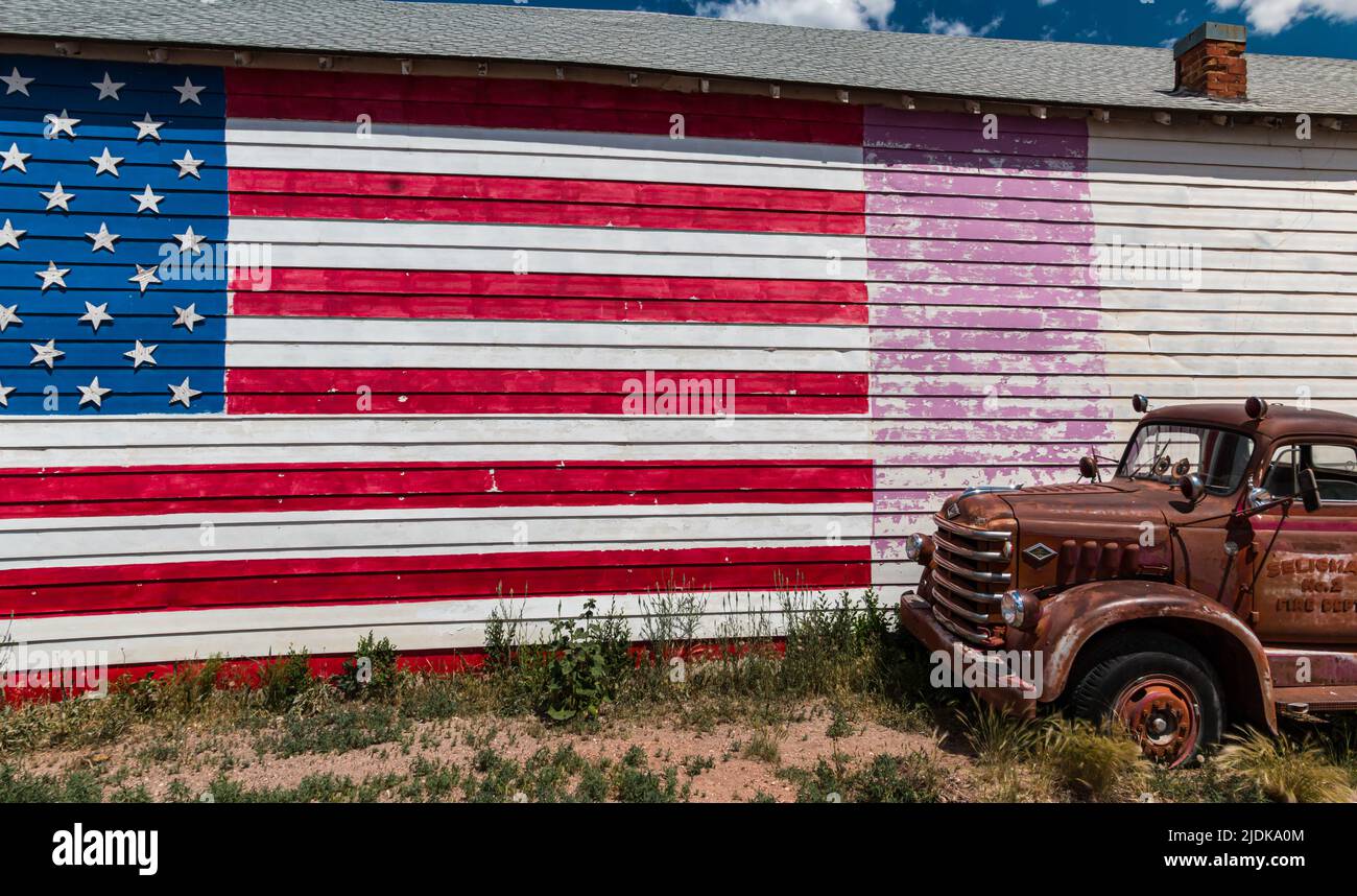 Vintage Diamond T Firetruck and American Flag on Route 66 Historic Highway, Seligman, Arizona, USA Stock Photo