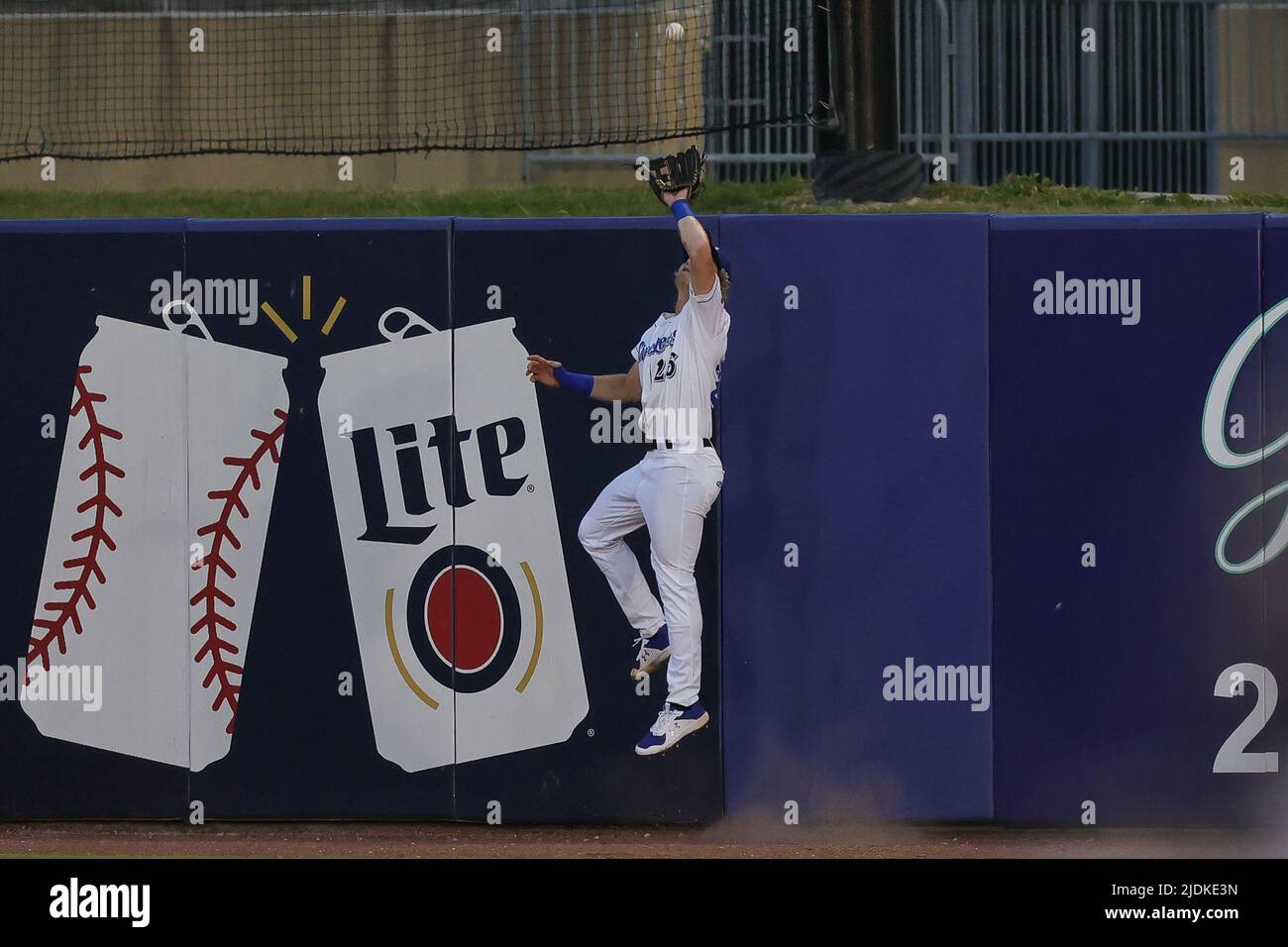 Biloxi, Mississippi, USA. 21st June, 2022. Biloxi Shuckers outfielder Joey Wiemer (26) collects his second hit that would have gone over the wall during an MiLB game between the Biloxi Shuckers and Pensacola Blue Wahoos at MGM Park in Biloxi, Mississippi. Bobby McDuffie/CSM/Alamy Live News Stock Photo