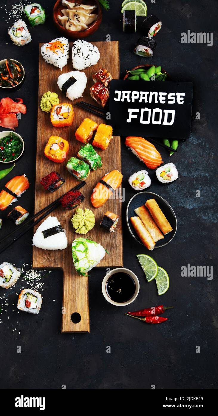 Japanese food assortment on dark background. Traditional food concept. Dishes and appetizers of indeed cuisine. Top view, copy space, flat lay Stock Photo
