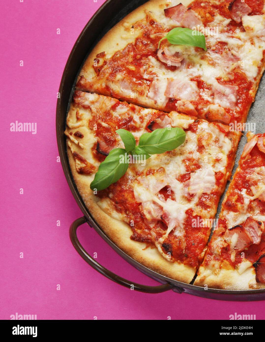 Pizza on pink background. Creative conception. Food delivery. Top view, flat lay, copy space Stock Photo