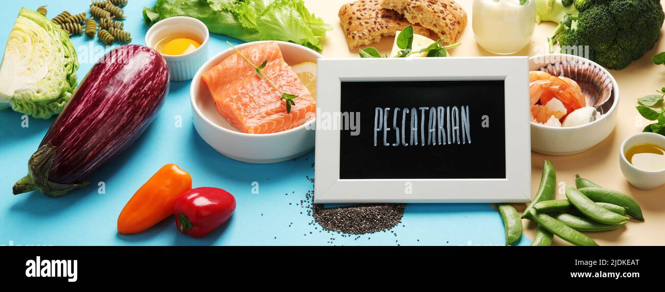 Pescatarian diet on colourful background. Vegetarian diet that includes fish or other aquatic animals. panorama Stock Photo