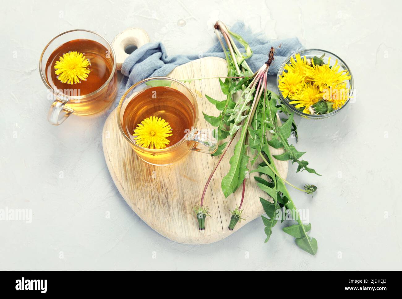 Delicious healthy tea made of dandelion flowers. Fragrant fresh herbs. Flat lay, top view, copy space Stock Photo