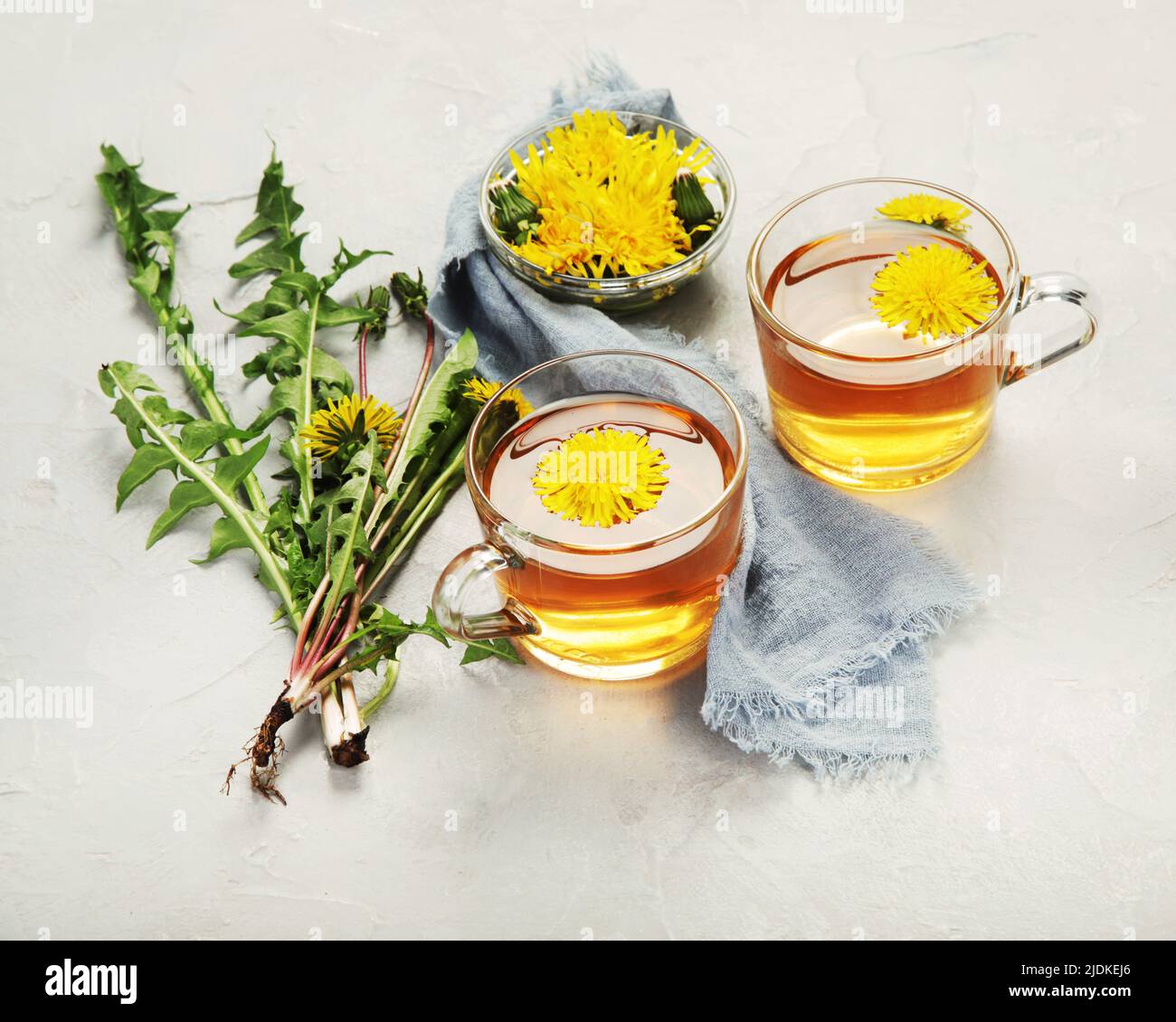 Delicious healthy tea made of dandelion flowers. Fragrant fresh herbs. Stock Photo