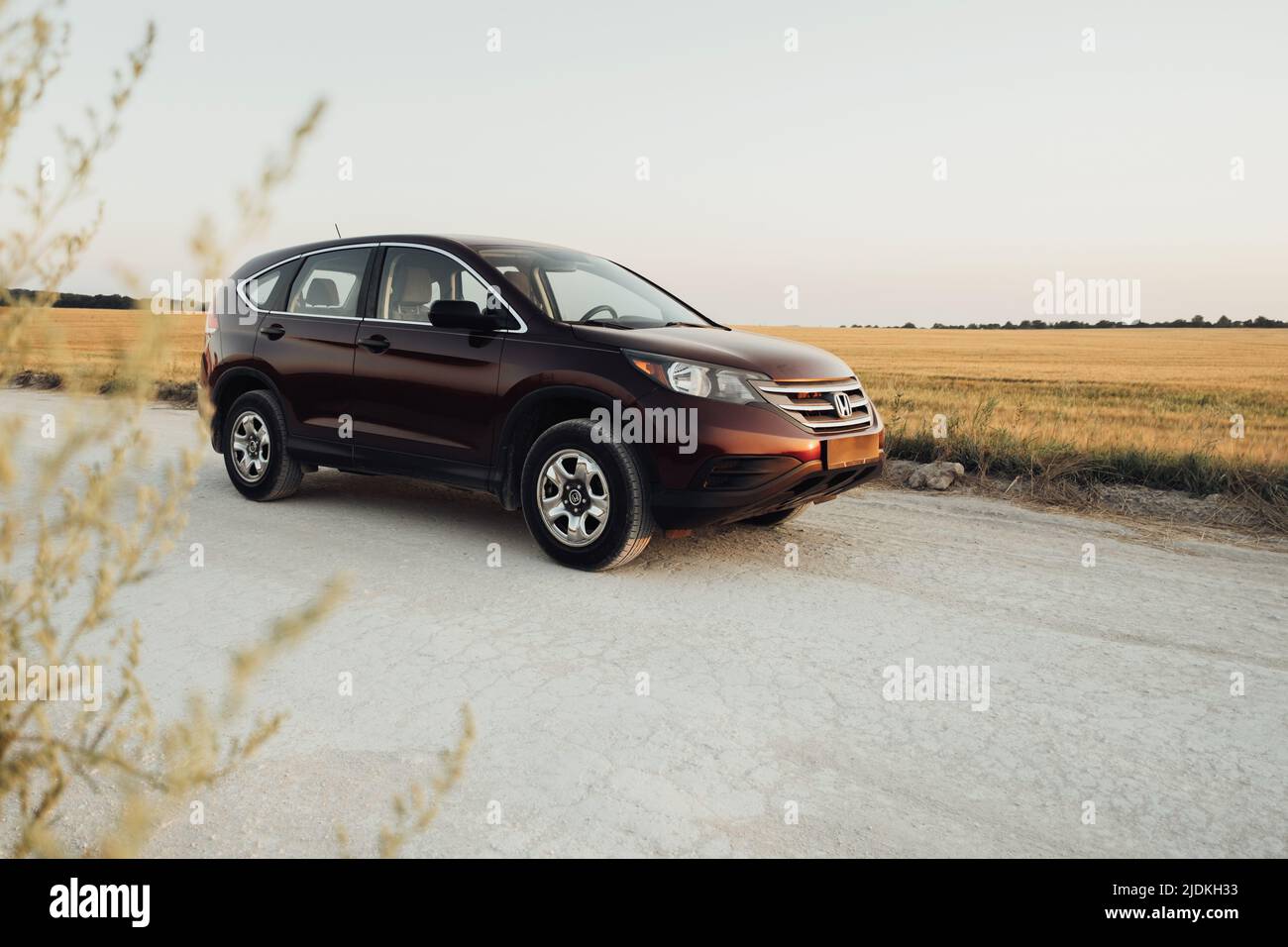TERNOPIL, Ukraine - July 21 2021: Honda CR-V on the Country Road Stock Photo