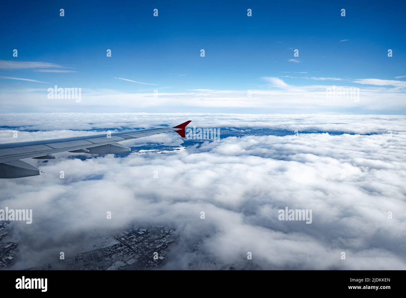 Aircraft wing above beautiful clouds and blue sky Stock Photo - Alamy