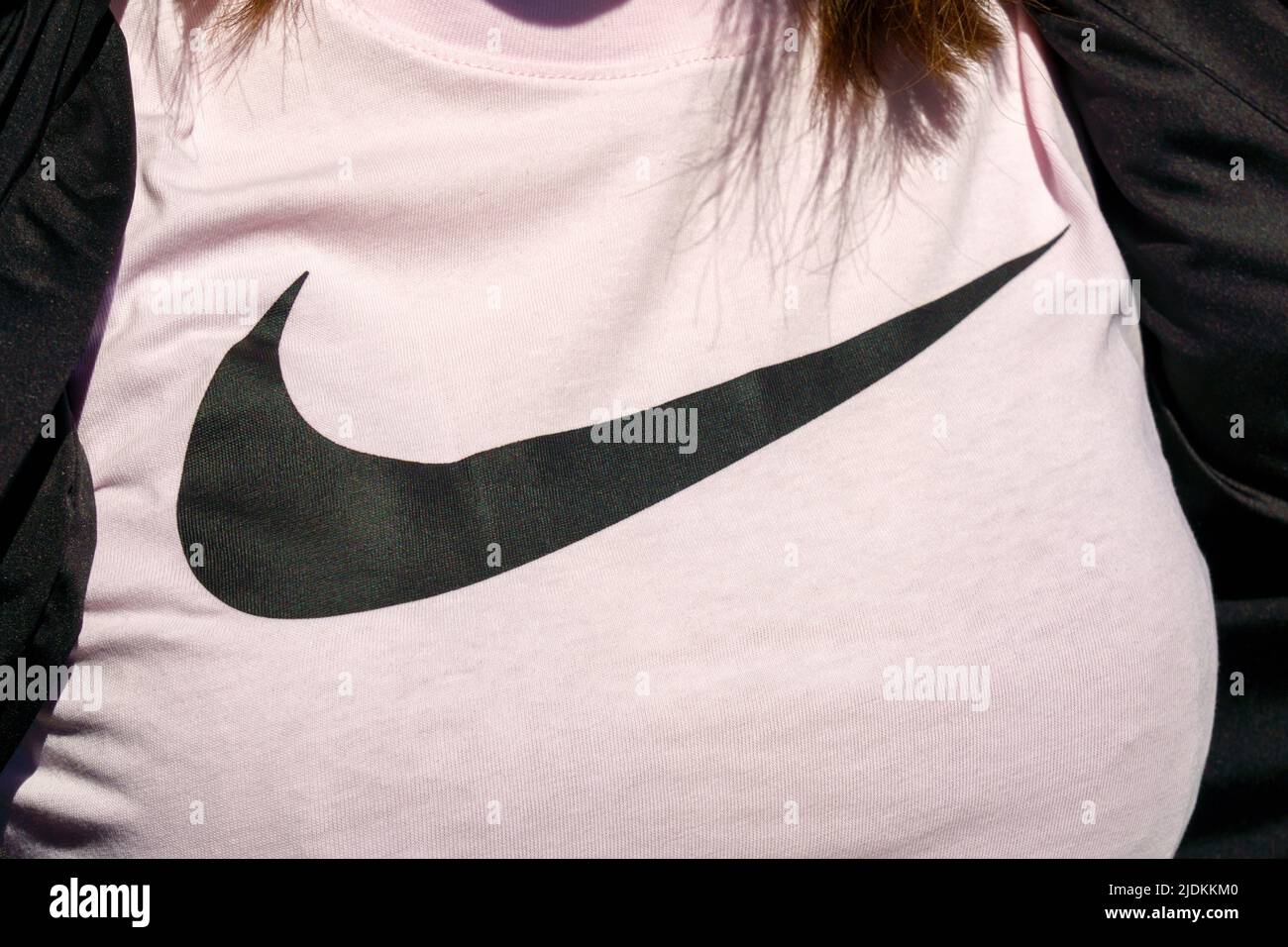 Tyumen, Russia-June 4, 2022: Nike logo on a woman T-shirt. Nike is a global  sports clothes and running at Nike stores are located all over the world  Stock Photo - Alamy