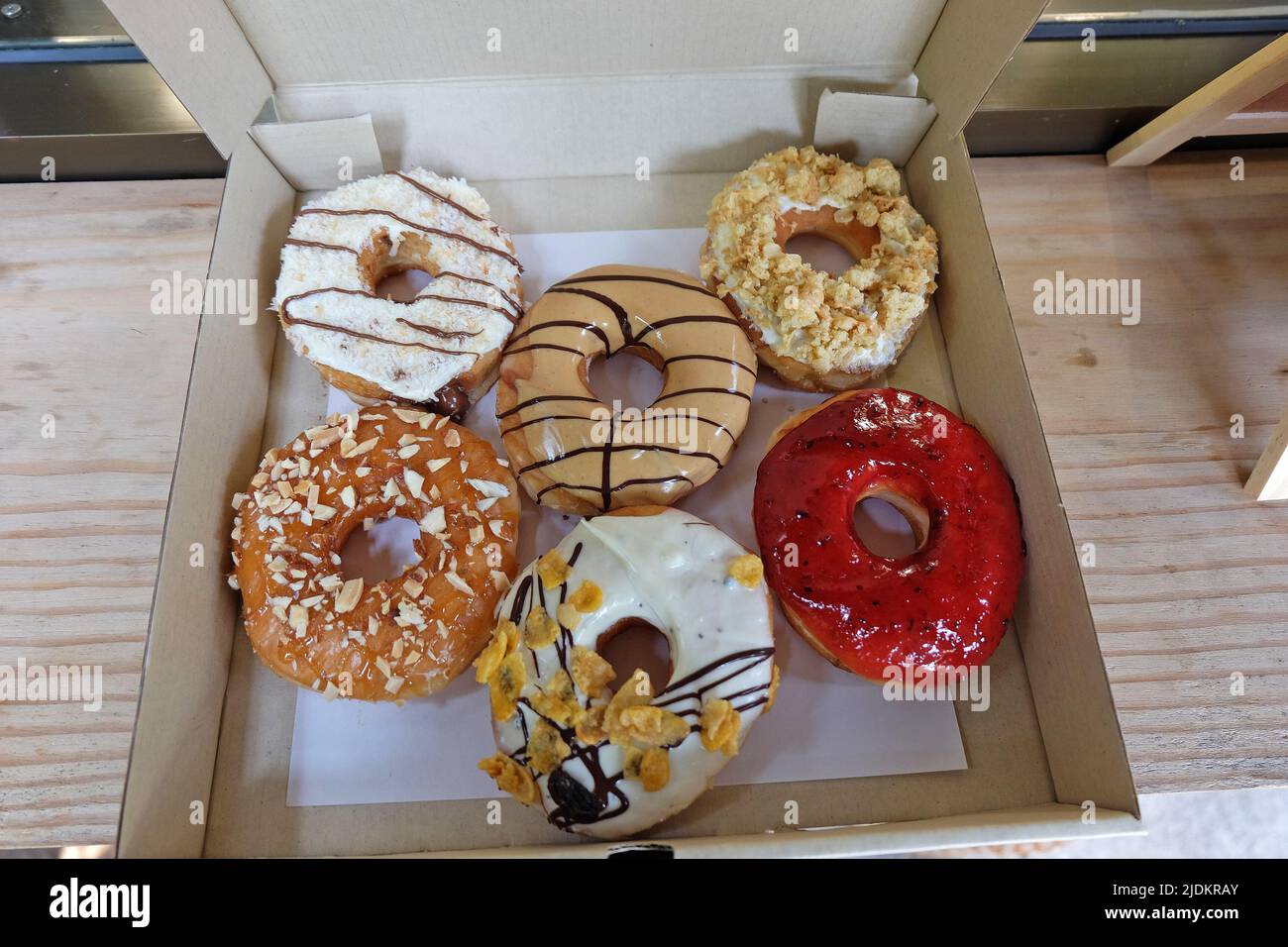Round chocolate doughnuts display hi-res stock photography and images ...