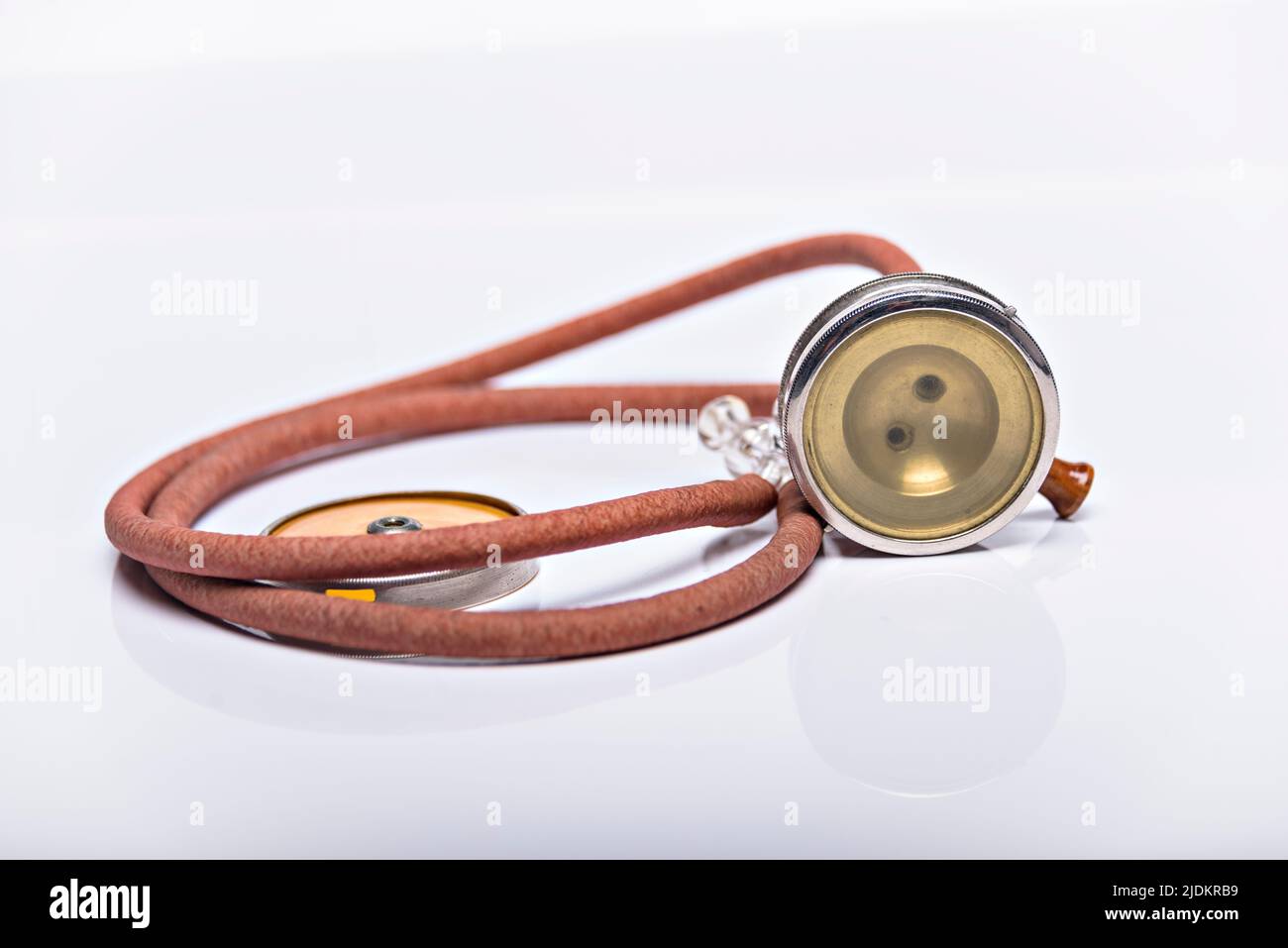 Medical Instrument vintage antique stethoscope isolated on white background. Stock Photo