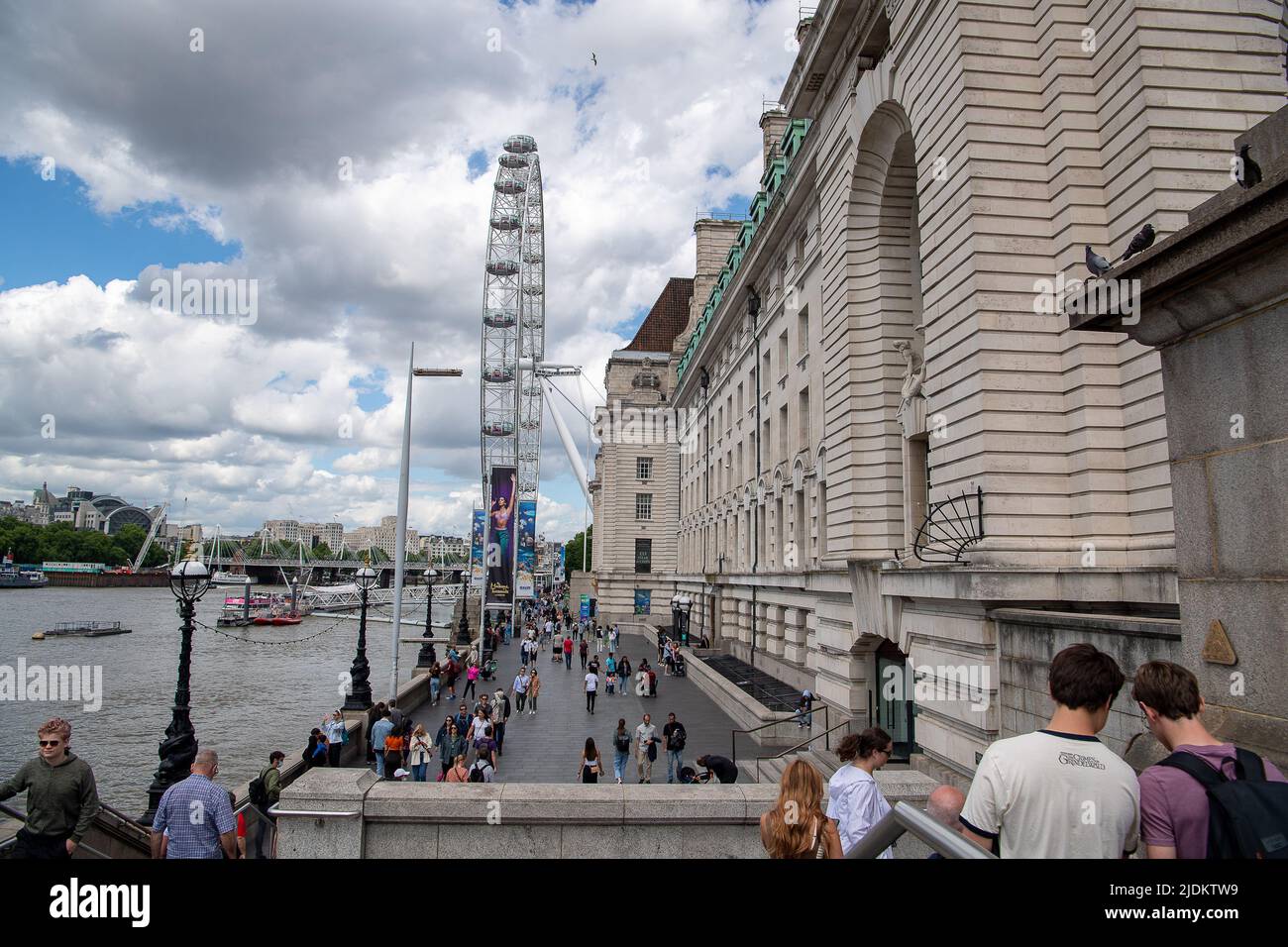 Westminster, London, UK. 8th June, 2022. A busy day in London as tourists walk past County Hall and the London Eye. Credit: Maureen McLean/Alamy Stock Photo