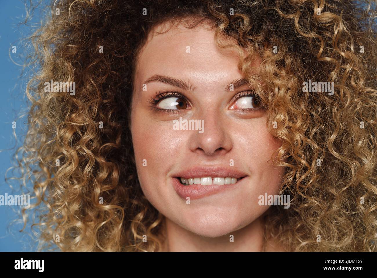 Blonde woman curly hair smiling hi-res stock photography and images - Alamy