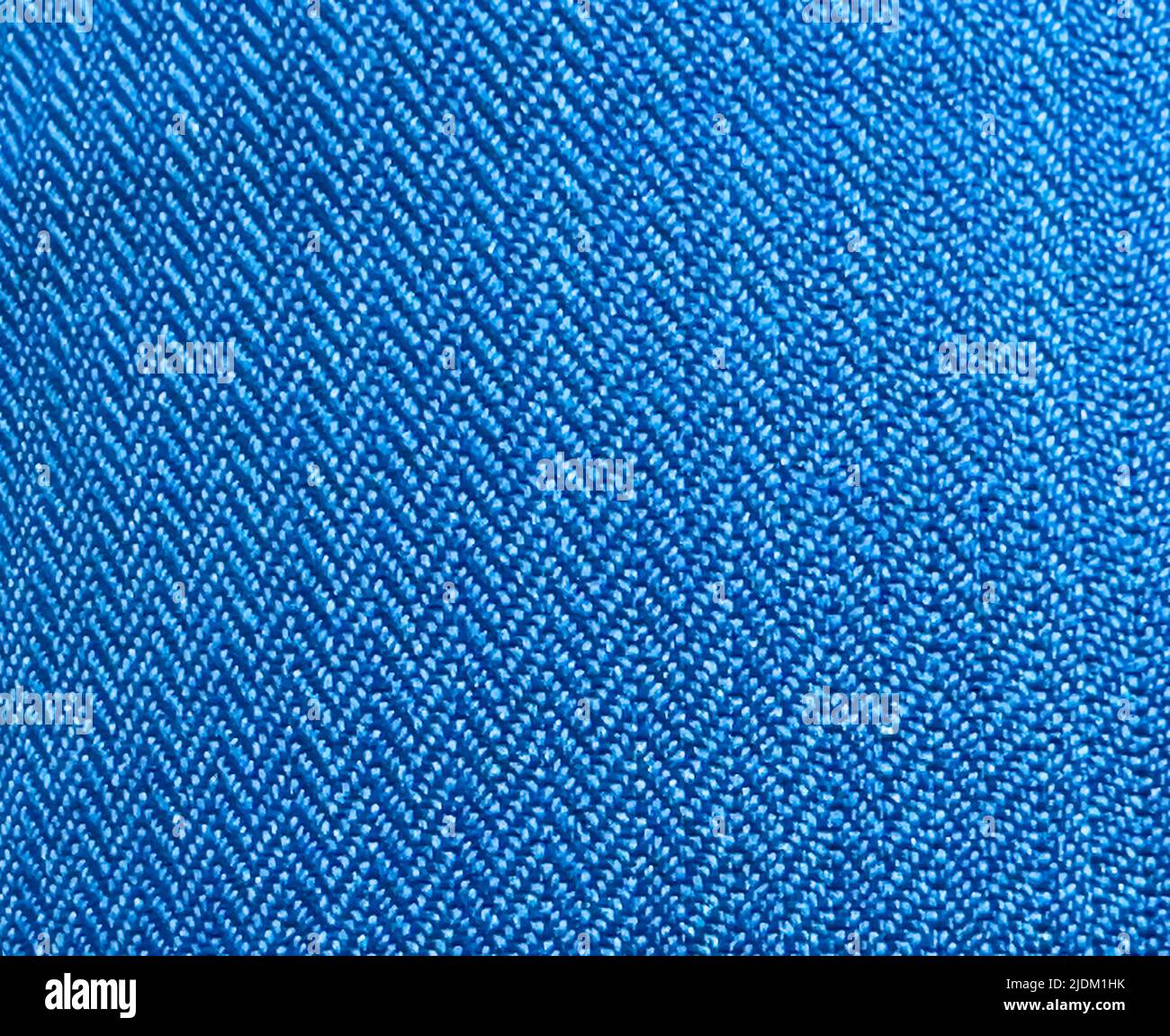 Pattern of blue fabric close-up with triangular shaped stitching Stock Photo