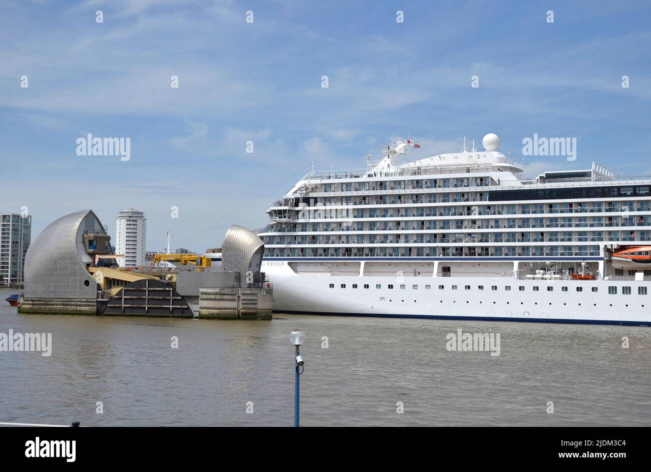 Cruise ship Viking Venus owned by Viking Ocean Cruises passing through the Thames Barrier on the River Thames in London Stock Photo