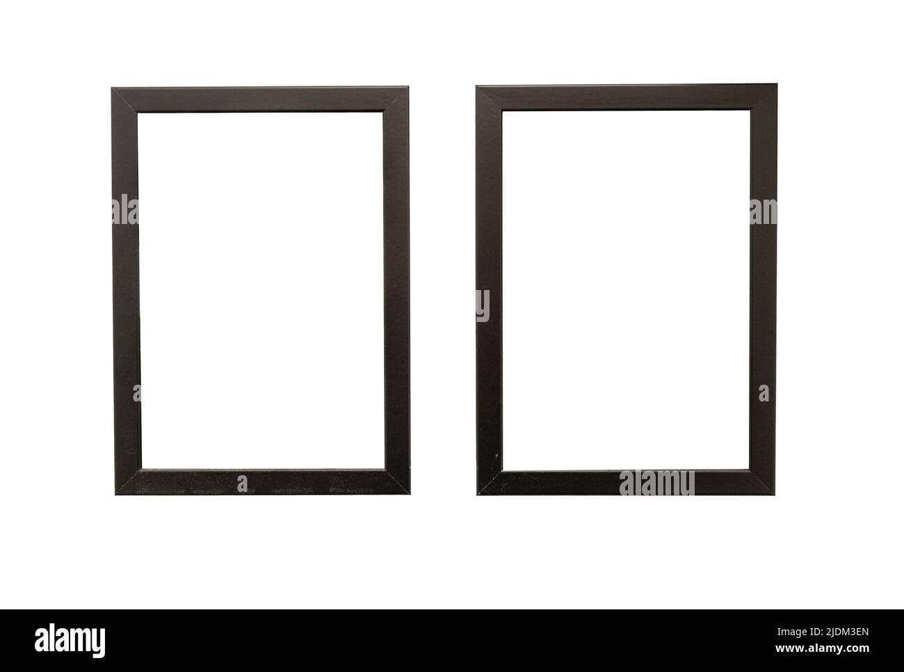 Two natural photo frames with blank space hanging on a wall, isolated on white Stock Photo