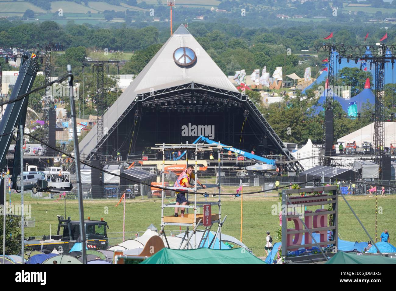 Glastonbury, UK. Wednesday, 22 June, 2022. The Pyramid Stage showing the CND logo in memory of Bruce Kent on the first day of the Glastonbury 2022 Festival. Photo: Richard Gray/Alamy Live News Stock Photo