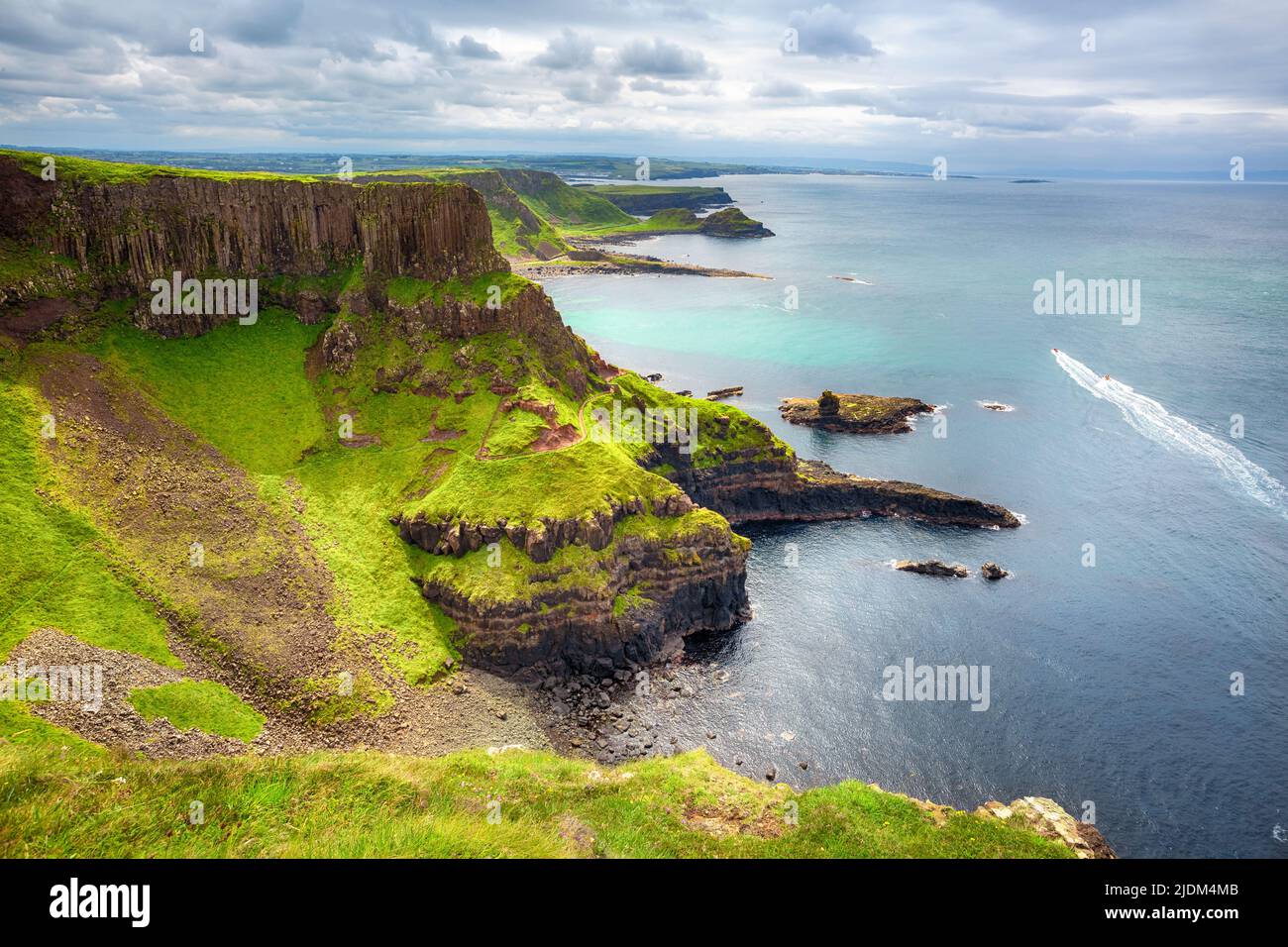 The Amphitheatre, Port Reostan Bay and Giant's Causeway on background, County Antrim, Northern Ireland, UK Stock Photo