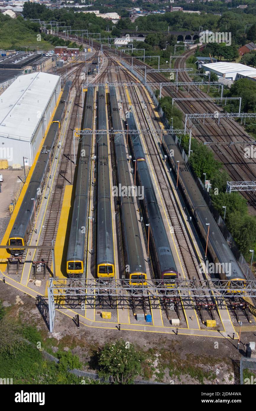 Soho TMD, Smethwick, Birmingham, England, June 22nd 2022. West Midlands Railway trains parked up and unused during the second day of Britain's national rail strike. The traction maintenance depot (TMD) is in Smetwick, Birmingham. The West Coast Mainline sits empty of running transport next to the depot. Railway workers walked out on Tuesday to strike for a 7 percent wage increase across the British networks. Pic by: Stop Press Media/ Alamy Live News Stock Photo