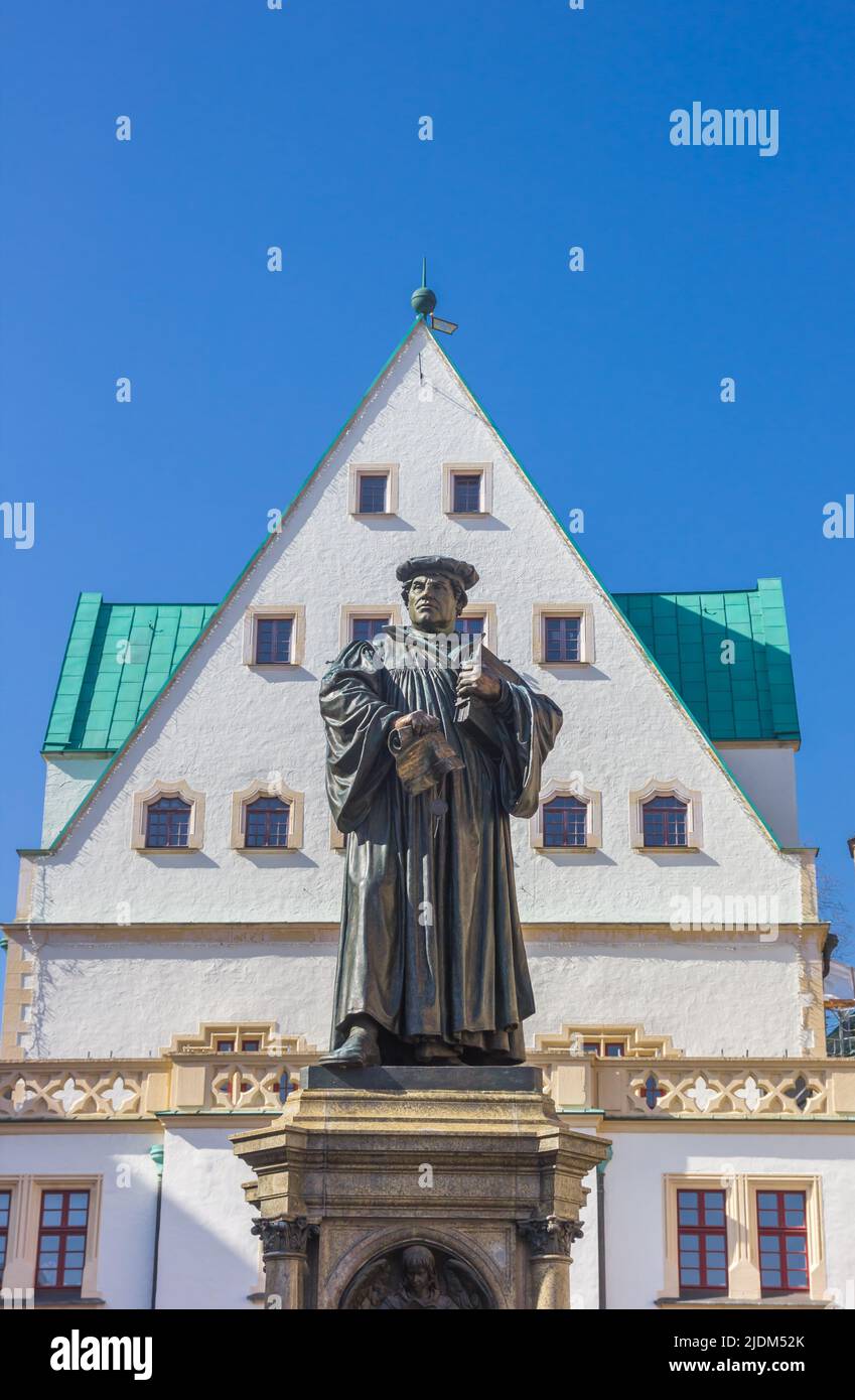 Statue of Martin Luther in front of the historic town hall of Eisleben, Germany Stock Photo