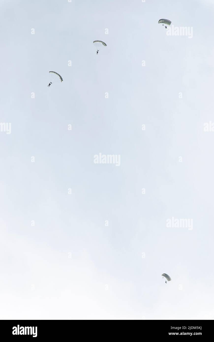 Commando Jump Landing paratroopers. Photo taken during the parachute jumping show ...