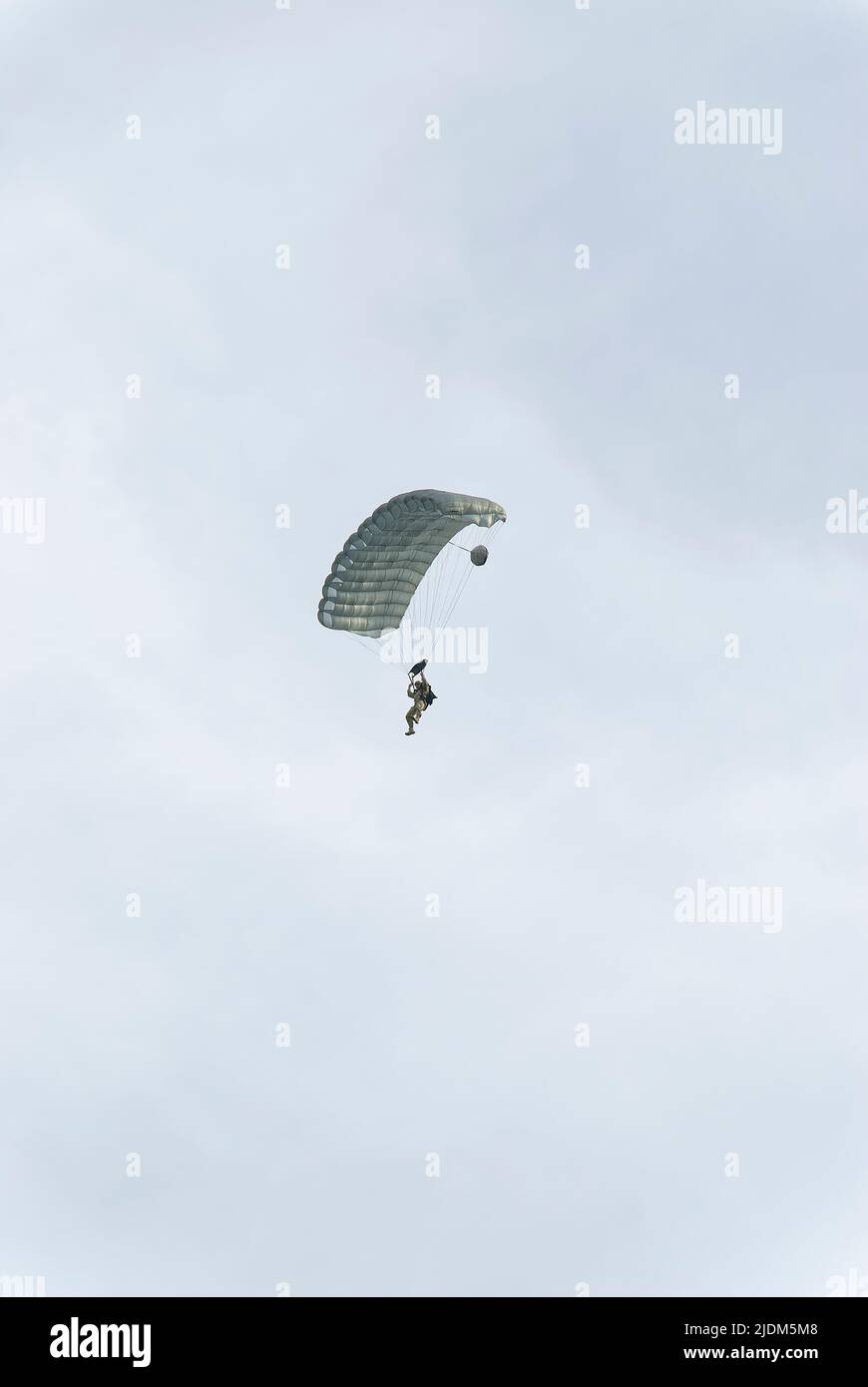 Lonely paratrooper. Photo taken during the parachute jumping show during the Commando Fest in Dziwnów - August 2020. Stock Photo
