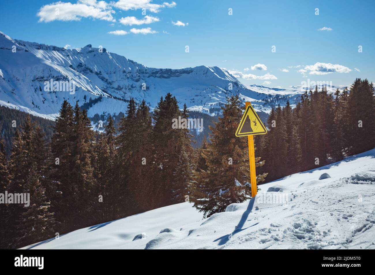Danger sign on side of the mountain ski track in mountains Stock Photo