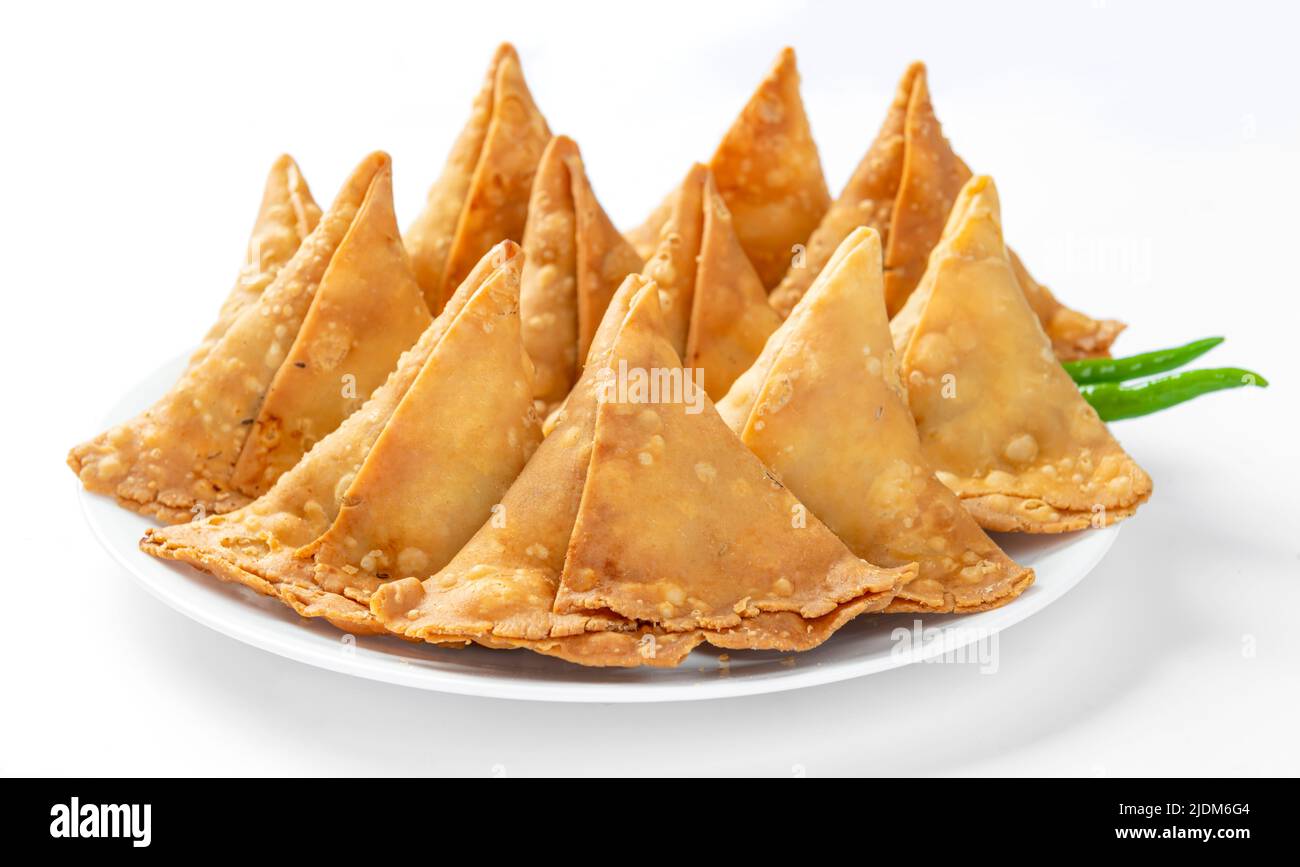 Potato Samosa or Aloo Samosa is a very popular snack food of asian people. It is made by mashed potatoes and spices and filled in dough sheets. Stock Photo