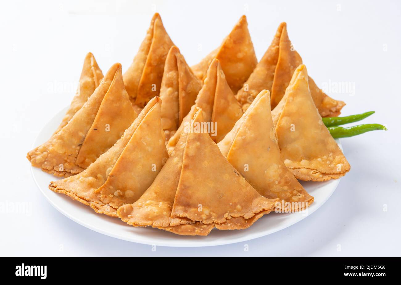 Potato Samosa or Aloo Samosa is a very popular snack food of asian people. It is made by mashed potatoes and spices and filled in dough sheets. Stock Photo