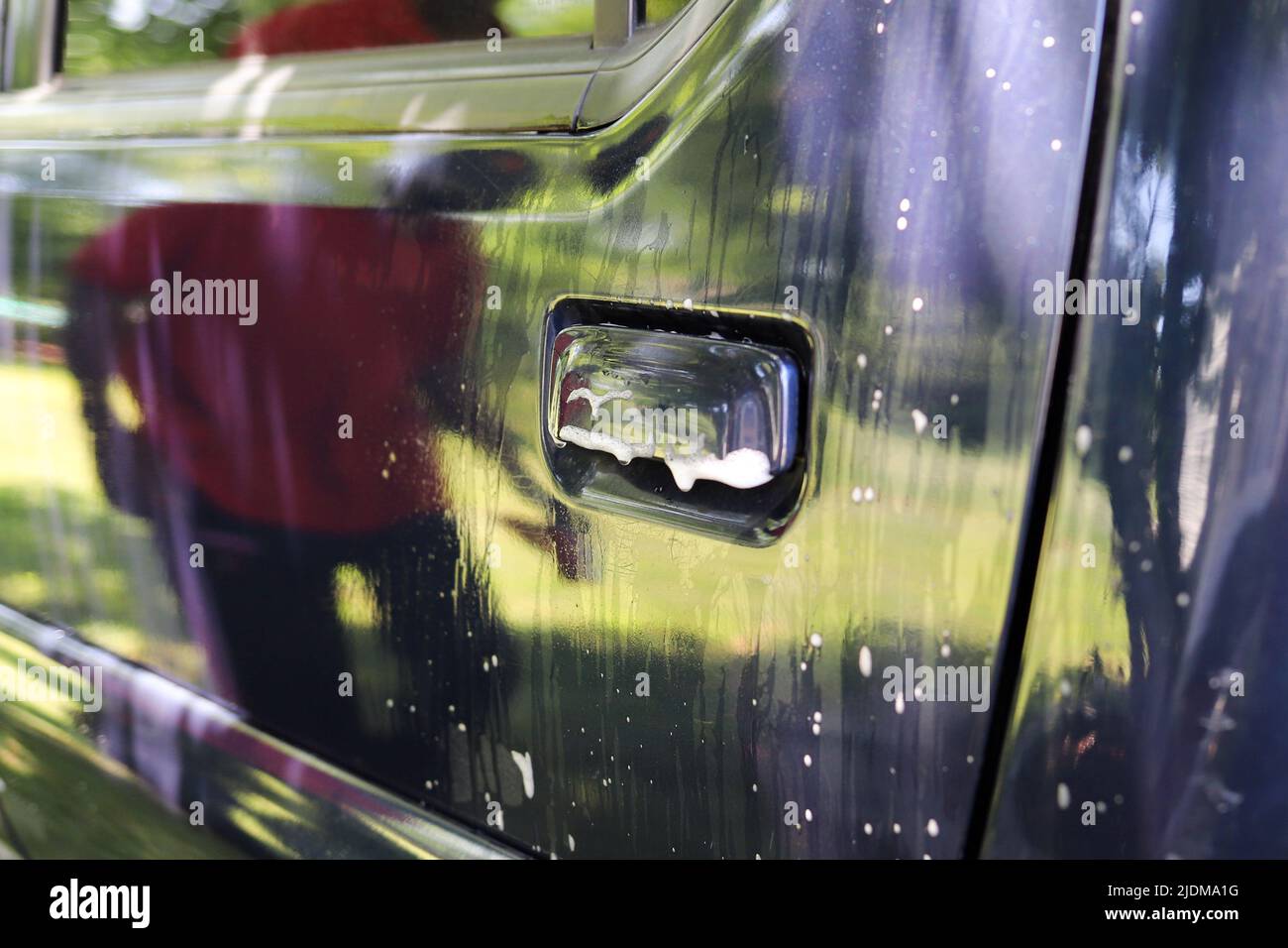 Soap suds on a freshly clean vehicle Stock Photo