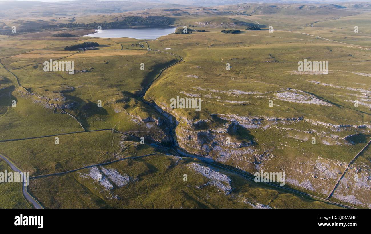 A drone shot of the limestone outcrop Comb Hill and surrounding area around of Malham and Malham Tarn Stock Photo