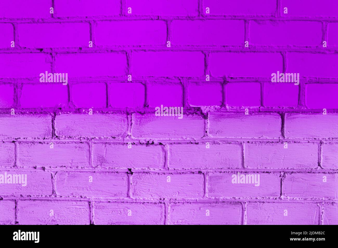 Brick wall paint two colors purple and lilac or violet abstract urban background design art texture. Stock Photo