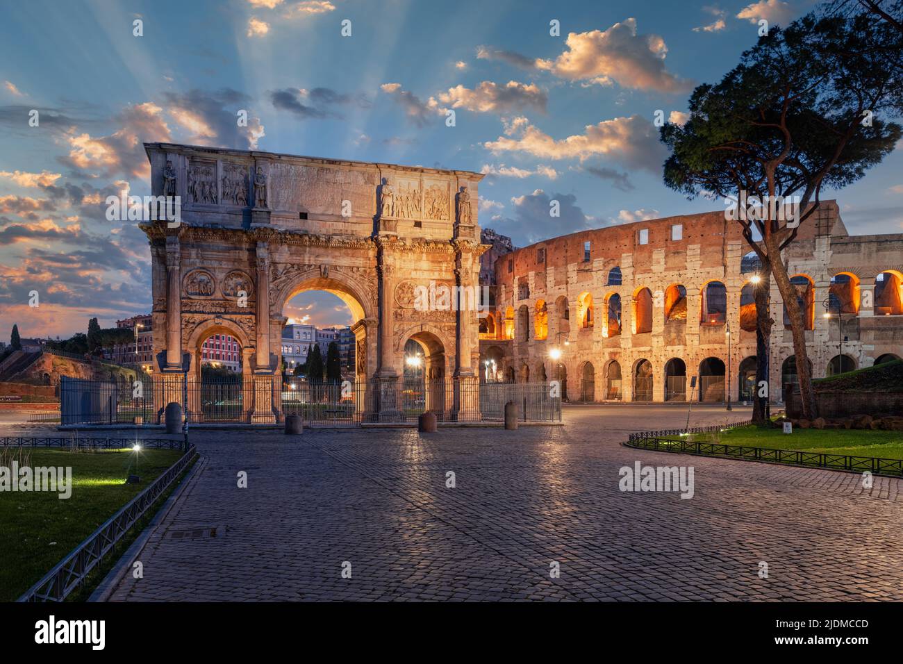Rome, Italy at the Arch of Constantine and the ancient Roman Colosseum at twilight. Stock Photo