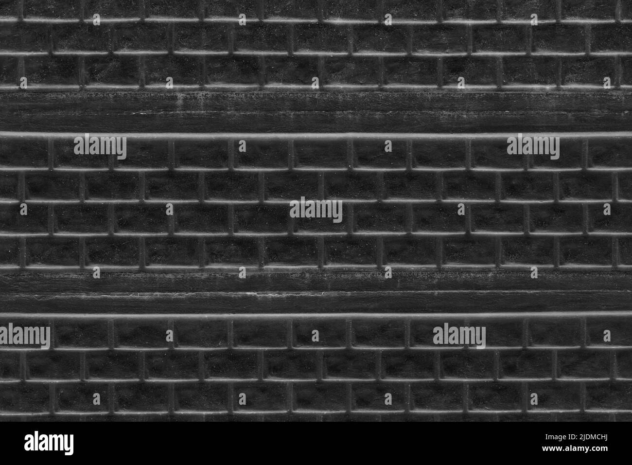 Black Stone Brick Fence Texture Dark Grunge Background Pattern Wallpaper. Stock Photo