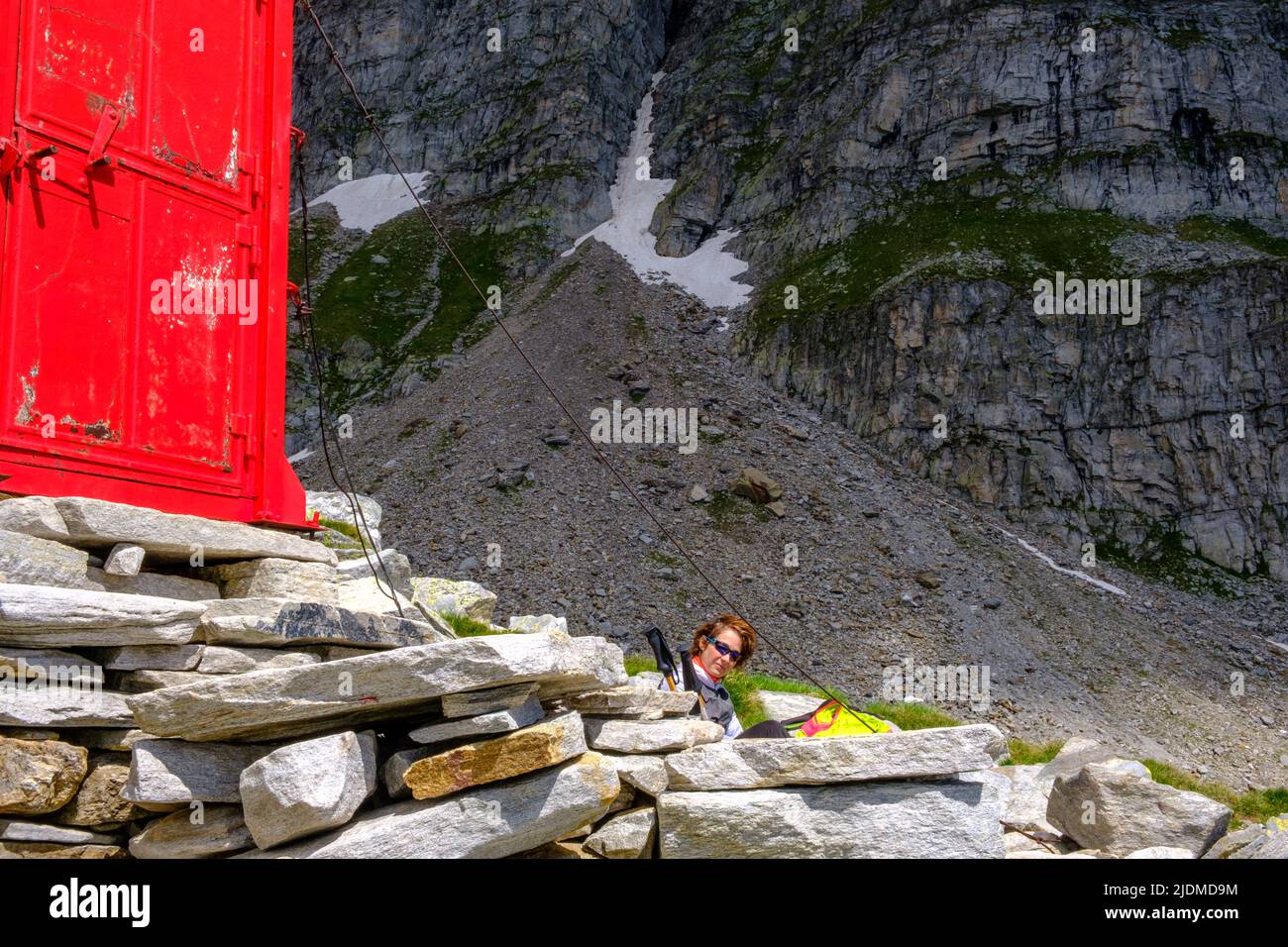 Woman alpinist at the Combi Lanza bivouac, Devero, Piedmont, Italy Stock Photo