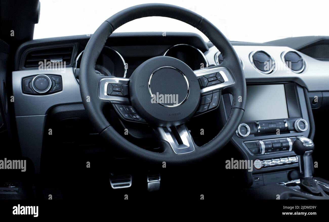 Steering Wheel, Head Monitor, And Gearbox Knob With Soft Focus In Car Stock Photo