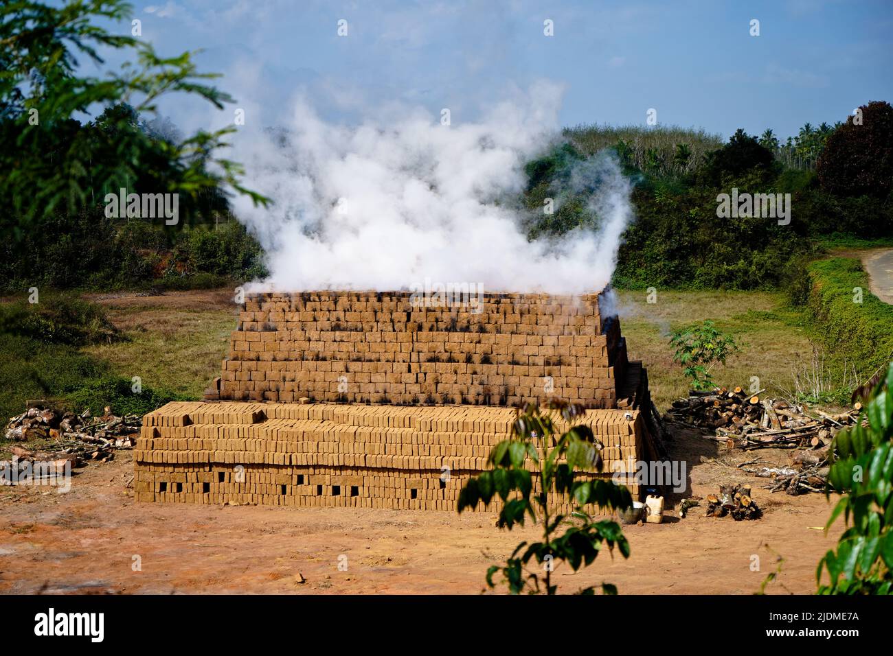 Drying and burning of bricks made of clay with fire wood, traditional way Stock Photo Alamy