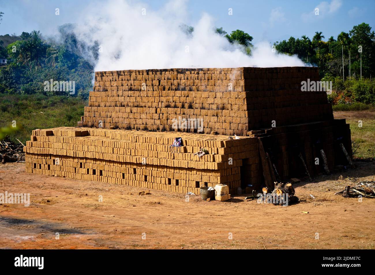 Drying and burning of bricks made of clay with fire wood, traditional way Stock Photo Alamy